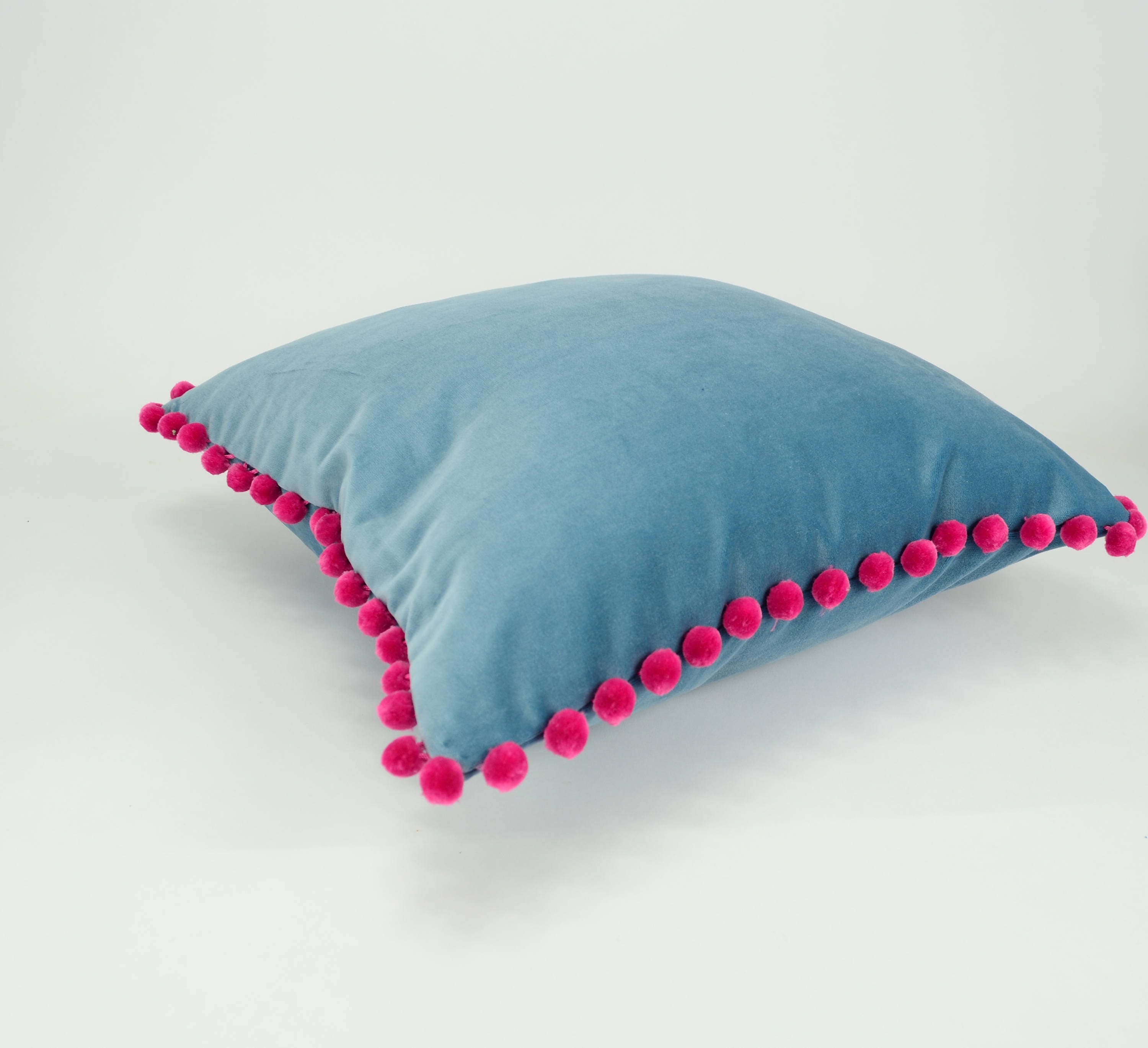 blue velvet pom pom pillow // pink pom pom cushion // blue and pink pillow