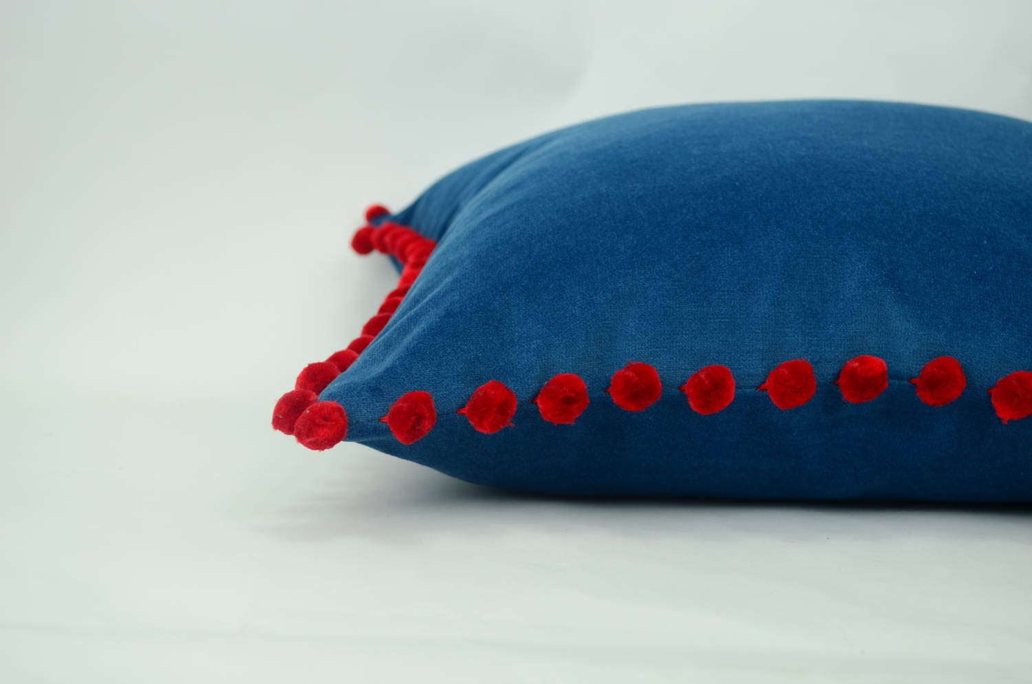 Blue pillow with red pom poms // velvet pom pom pillow //  blue and red pom cushion // blue pom poms pillow // red pom poms cushion